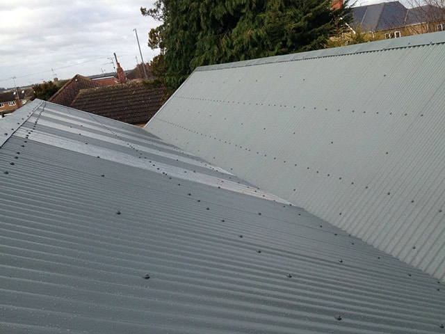 A new roof on a warehouse having had the old asbestos roof replaced in Kettering, Northamptonshire.