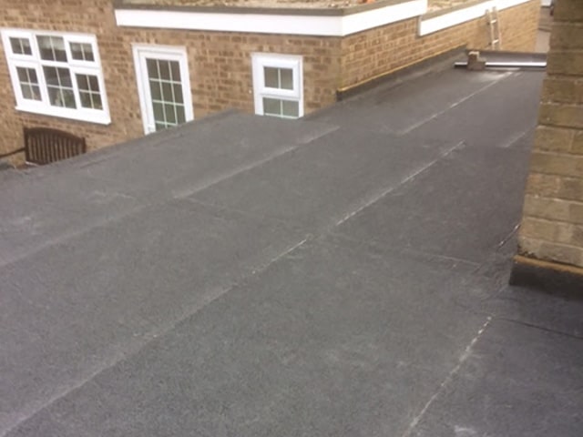 House flat roof installation of a new extension in Kettering, Northamptonshire.